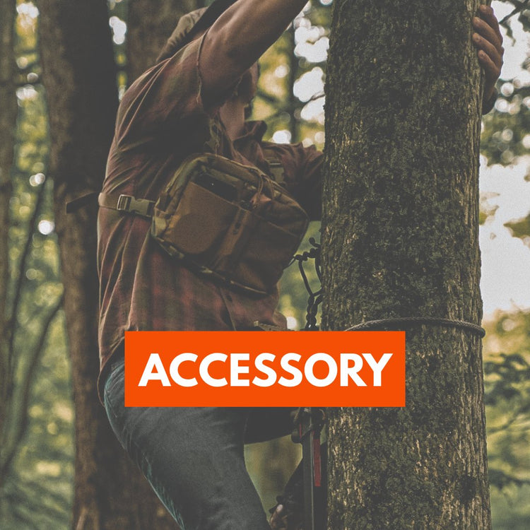 a man climbing a tree with a chest rig