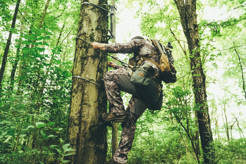Load image into Gallery viewer, Hunter climbing tree climbing sticks wearing the BullPath El Toro single panel hunting saddle