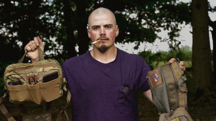 a man holding up a saddle hunting setup